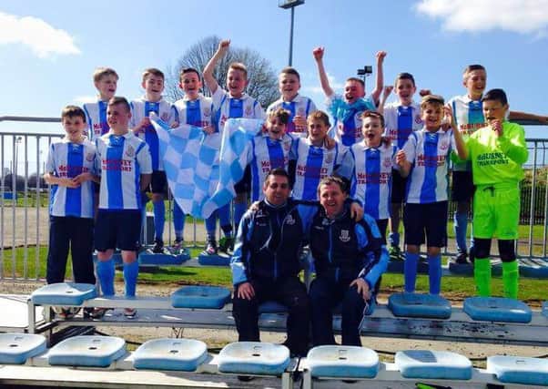 The league-winning Ballymena United under 13 side with coach Alan McCausland and manager Colin Lorimer.