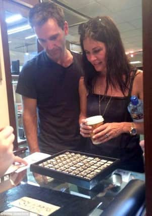 Courteney Cox and Johnny McDaid are presented with rings at Cooley Jewellers during a trip to Derry in 2014