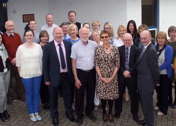 Robert Starrs is joined by his wife, Jane, along with colleagues from the Housing Executive including Frank O'Connor, Regional Manager, Brendan Doherty, Area Manager and Breige Mullaghan, local housing manager at his retirement function in the Ballycastle office.