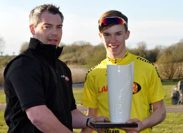 Cameron McIntyre picks up the Lakeland Two Day overall winner's trophy in Enniskillen