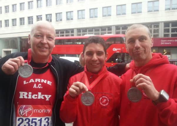 Larne Athletics Club members Ricky Mann, David Nobel and Martan Keane after completing the London Marathon.  INLT 17-685-CON