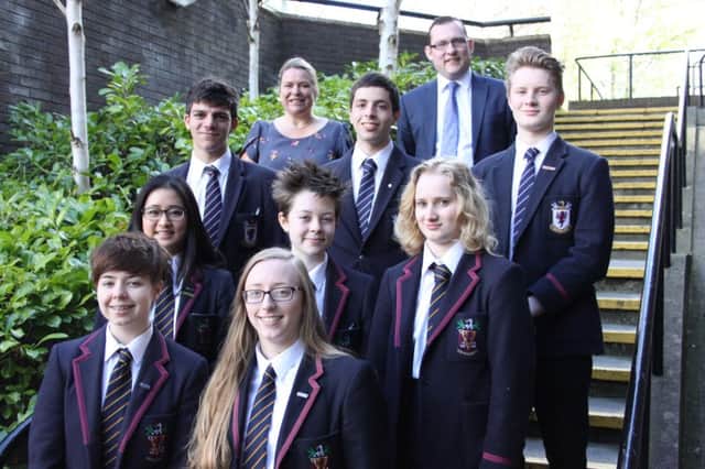 Wallace High School Principal, Mrs Deborah O'Hare and Mr Michael lowry pictured with the eight students who have been awarded places on residential programmes organised by Villiers Park.