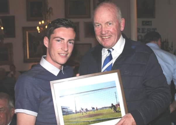 Chairman Adrian Teer presents Andy McGrory with a picture of his special goal.