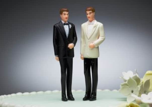 Two groom figurines on top of wedding cake

Gay wedding