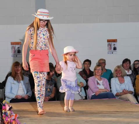 hand in hand on the catwalk at the Magherafelt High School Fashion Show. IMM16-526.