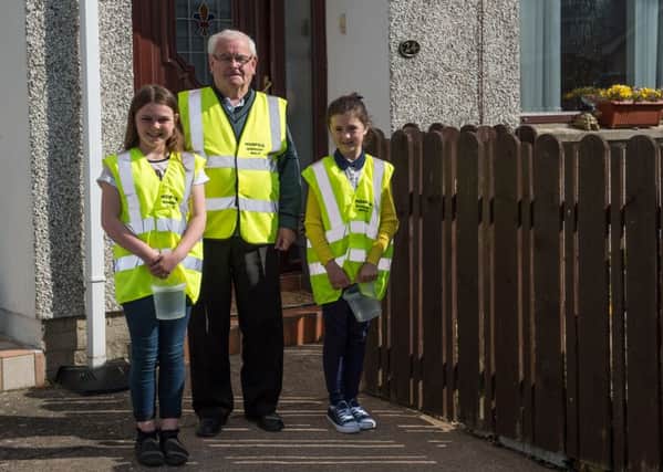 Eamon Wright with his granddaughters Kelie Wright and Ellie Moreton who will be doing a 10 mile sponsored walk on behalf of the Southern Area Hospice, leaving from the Centra shop in Magheralin on Friday morning.  INLM1915-400