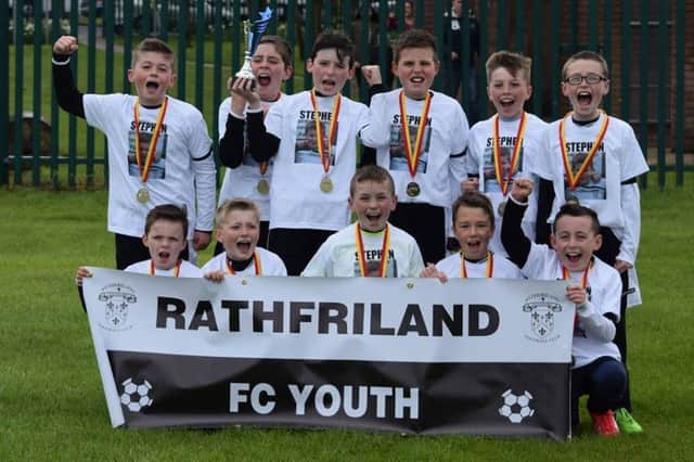 Rathfriland Youth U11s celebrate their Cup win, complete with t-shirts of team-mate Stephen McElroy, who tragically passed away last month.