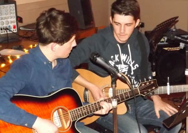 Dean and Mark play "Simon and Garfunkel" at an "open mic" event held recently at Linn Community Centre. INLT 18-655-CON