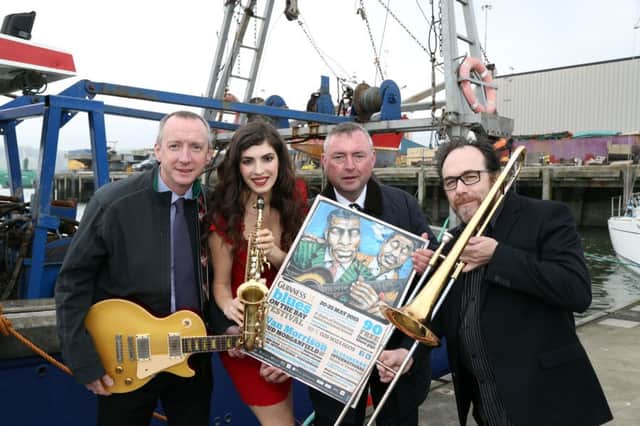 Mark Mulholland, Diageo Northern , Gemma McCorry, Paul Callan Diageo Northern and with Event Director Ian Sands celebrate the announcement of an exciting line up for the 17th International Guinness Blues on the Bay festival which takes place 20 - 25 May 2015 at the picturesque town of Warrenpoint, County Down. Photography by  Darren Kidd   /  Press Eye