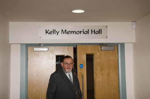 Rev Robert Simpson entering the main hall Which has kept the Kelly Memorial name.