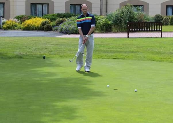 Andy Young, runner-up in Saturday's Club Stableford, practicing his putting ahead of the first Golfer of the Year competition.