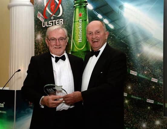 Tom receives his award from President of the Ulster branch John Kinnear. INBM19-15