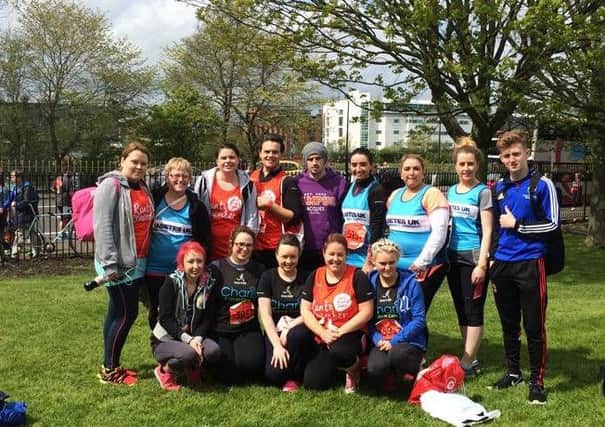 The runners from Springisland Supermarket, who took part in the Belfast Marathon in aid of three local charities