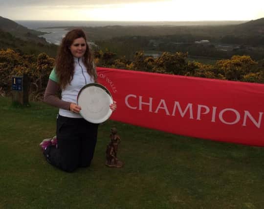 Olivia Mehaffey shows off her Welsh Ladies Open Strokeplay trophy.