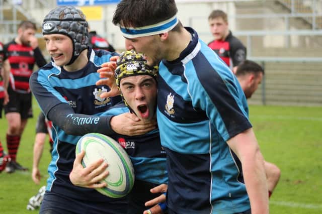 Dromore u18s celebrate a try during their Ulster Carpets Cup final victory.