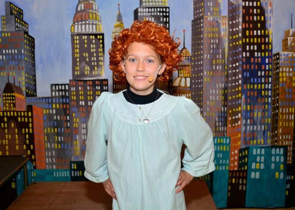 Caitlin McKinley played the lead role in Eden Primary School's production of 'Annie'. INCT 18-005-GR