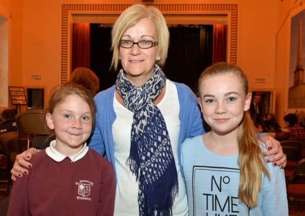 Hermione Reid (right) received a highly commended award in the Own Choice Poem 11 years and under 14 years class at the 85th Annual Carrickfergus Music Festival is pictured with her mum, Wendy and sister, Tabatha. INCT 18-005-PSB