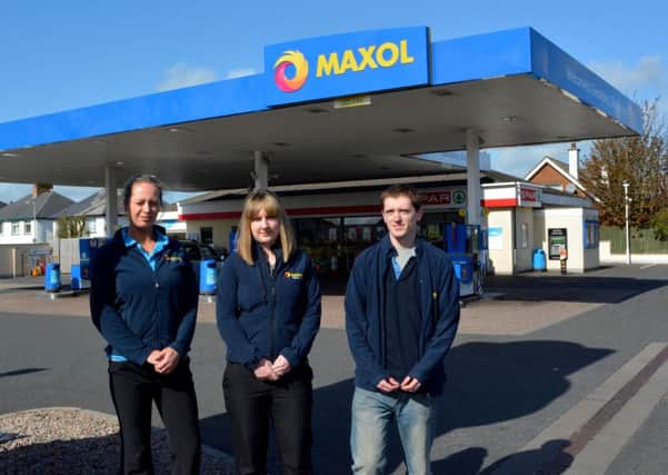 Adele Brown, Rebecca Ingrim and David Brown from Glenabbey service station on the Antrim Rd. INNT 18-041-GR