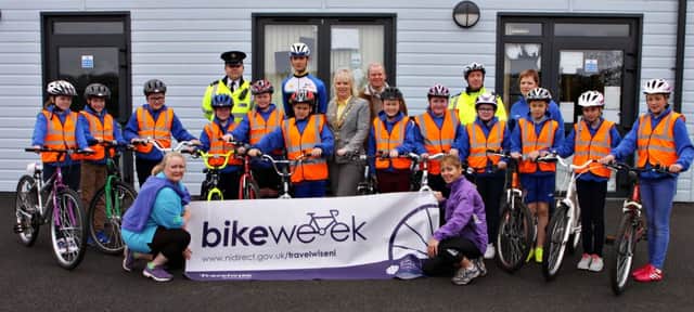 I BIKE IT. Pictured launching  Bike Week at Lislagan PS along with Mayor Cllr Michelle Knight-McQuillan are organisers Sonya Crawford and Joan Trengove of BCC, Cllr Tom McKeown, Stewart Lafferty and PSNI members and pupils.INBM20-15 097SC