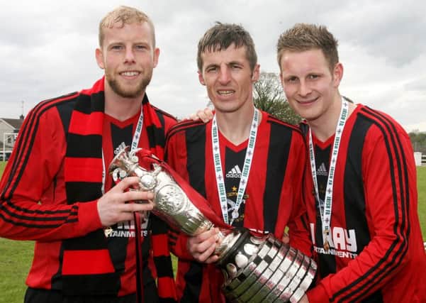 Goal scorers Jasin Magill, David Nicholl and Paul McNeill with the Junior Cup. INBT19-265AC