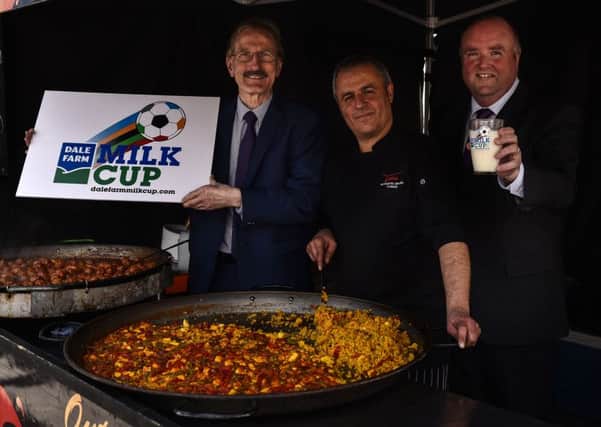 Spanish football fan Carmelo Lopez, from Tapitas Spanish caterers in Belfast, will enjoy a taste of home this summer when Real Sociedad and Malaga compete at the Dale Farm Milk Cup. With him are Dale Farm commercial director Jason Hempton (right) and tournament chairman Victor Leonard.