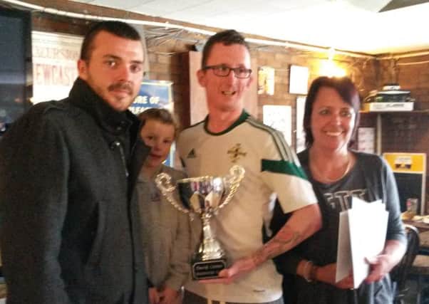 The David Linton Memorial Cup was presented to Geoffrey Tilley by Philip Linton, his mother Carmen and David Linton's daughter Sophie Linton by Philip Linton, his mother Carmen and David Linton's daughter Sophie Linton following a football match played at The Cliff recently. INLT 19-658-CON