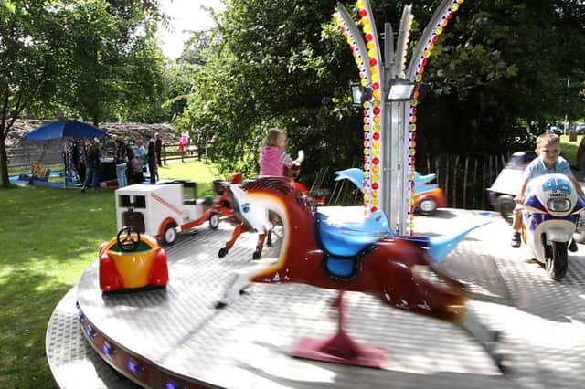 Children get the chance to enjoy amusement rides at the fun day Marie Curie findraiser in the Roe Valley Country Park on Sunday. INLV3414-367KDR