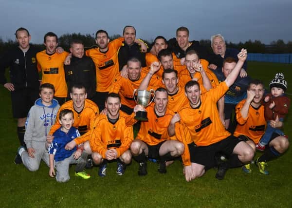 The Lisahally players celebrate after lifting the City Cup at Wilton Park on Friday evening. INLS1915-130KM