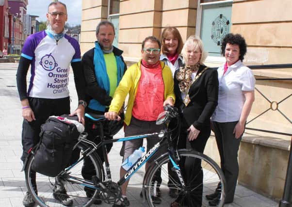 TV presenter Timmy Mallett and his friends, Tim Rose and Andy Burroughs are welcomed to Coleraine by Causeway Coast and Glens District Council mayor Michelle Knight-McQuillan and Tourist Information Office staff, Anne Shiels and Siobhan McKenna.