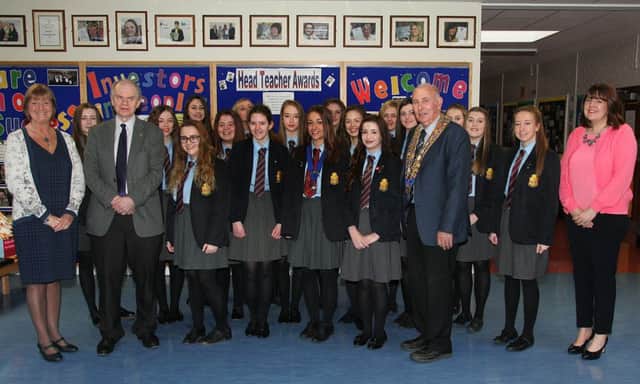 Rotarians Jim Dunlop and Sam Crowe, president of the Carrick club, with Jacqueline Stewart (extreme left), principlal of Downshire School, Julie McClean (right),  head of sixth form and members of the new Interact Club INCT 19-707-CON