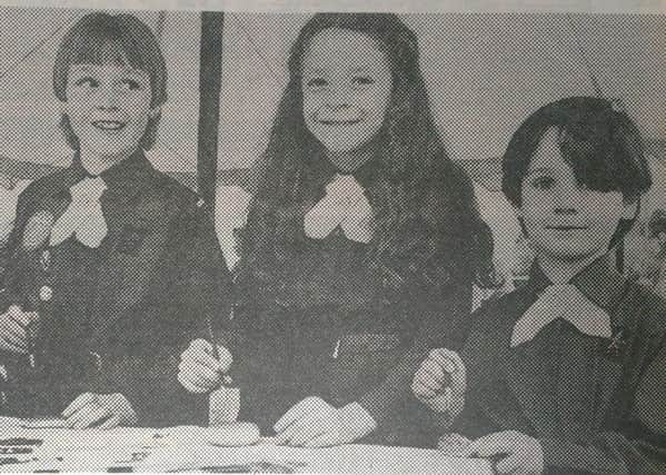 Painting stones at the crafts stand at Woodlawn in May 1985 were (from left) Michelle OHara and Vicky Kearney, both 4th Carrickfergus and Lynda McDowell, 1st Carrickfergus. INCT 19-750-CON