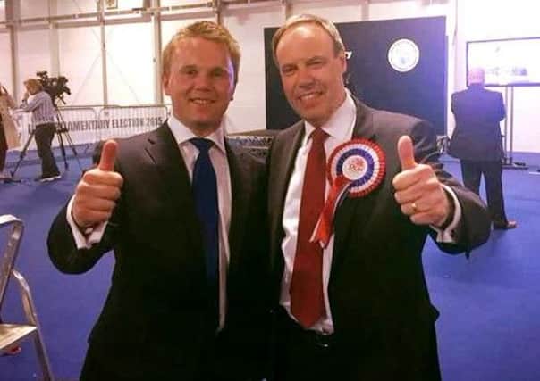 Cllr Thomas Hogg (left) celebrates the DUP's win in North Belfast with Nigel Dodds MP.