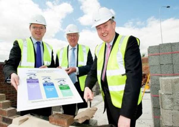 (L-R) Cameron Watt, Chief Executive of NIFHA, with the Chairman of the Housing Executive Donald Hoodless, and Minister  Mervyn Storey, announcing the development figures. (Submitted Picture).