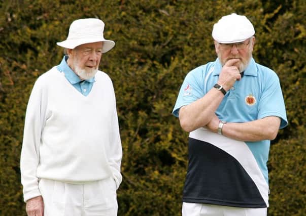 Ballymena C team members Leslie Jackson and John Montgomery discuss tactics during their match with Williowfield C. INBT20-246AC