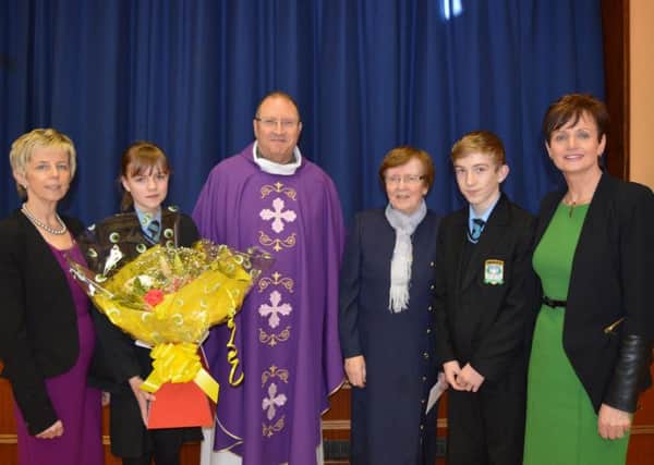 Sister Rose Devlin of the Holy Family Sisters of Bordeaux with representatives of St. Colms High School.