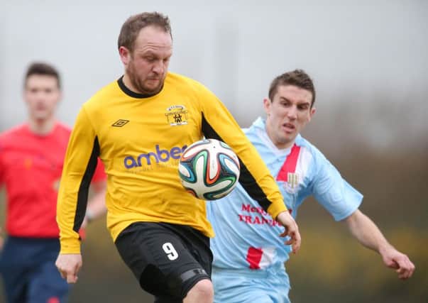 Mark Magennis, pictured here playing for Harland & Wolff Welders against Ballymena United in the Irish Cup this season, and Gary Thompson will be team-mates at the Showgrounds next season. Picture: Press Eye.