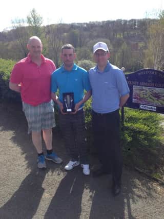 The Lost Boys' Golf Society Armagh outing winner Craig Anderson (centre) being congratulated by Captain Garreth Sloan and Vice Captain David Sterritt.
