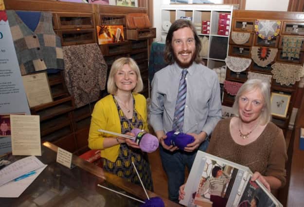 REPLICA. Fiona Murdock, who had an exact replica of her Mum's (Sally's Wool Shop) on display at the Town Hall on Thursday night, pictured with Margaret Edgar and Daniel Taylor.INBM20-15 018SC.