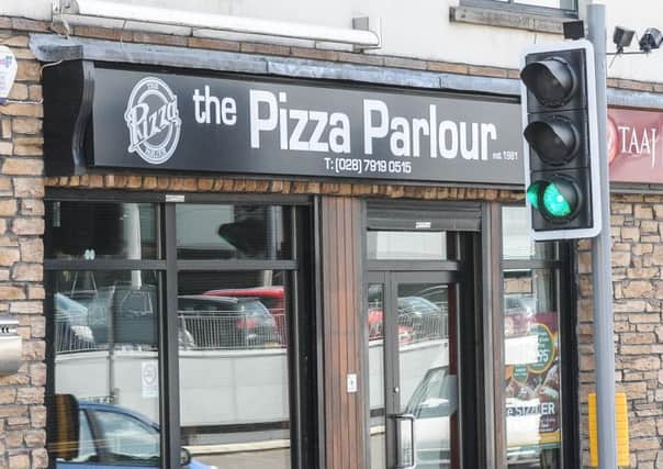 The Pizza Parlour in Queen Street, Magherafelt.....getting the 'Green Light' from all the customers. INMM18-547.