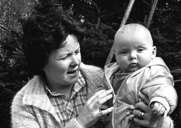 Mrs June McMullin with her seven-month old baby.