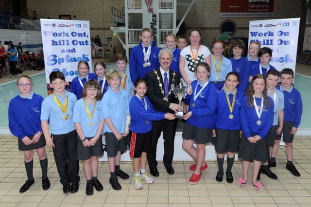 The Mayor, Councillor Thomas Beckett with the  pupils of Downshire Primary, who won the Overall School at the 2015 Primary Schools Swimming Gala.