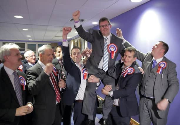 Jeffrey Donaldson celebrates with DUP colleagues after topping the poll at the Lagan Valley election count. US1519-501cd  Picture: Cliff Donaldson
