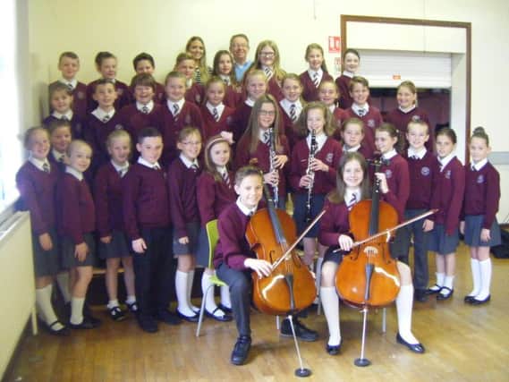 Woodlawn Primary School instrumentalists and choir members who took part in this year's Carrickfergus Music Festival. INCT20-702-CON