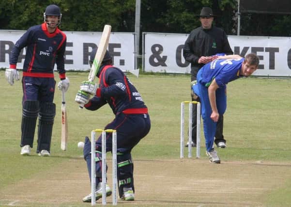 Graeme McCarter of the North West Warriors in bowling action against Northern Knights at Rugby Avenue on Sunday. Picture by Mark Jamieson.