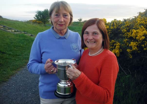 Kay Doherty, Greencastle Ladies Captain (right) presents Kate Lowe after she secured the Duncreigh Cup.