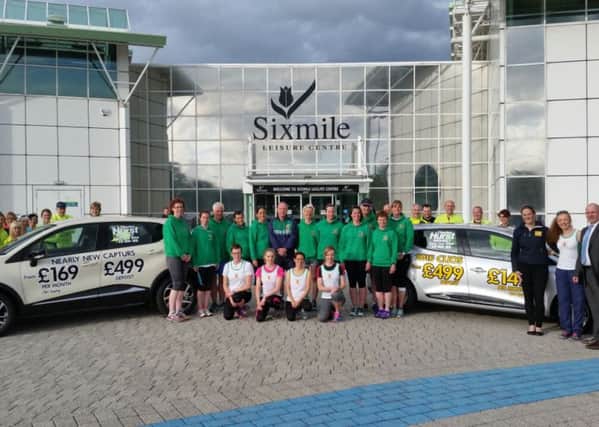 County Antrim Harriers with Sales Manager of main sponsor Charles Hurst Renault John Platt and Sales Executive Samantha Laming. INLT-20-709-con