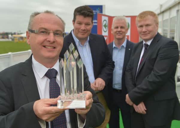 Cookstown pork manufacturing company Karro was Henderson Wholesaleâ¬"s Overall Local Supplier of the Year at the companyâ¬"s awards held at the Balmoral Show. From left, Alistair McQuillan from Karro; Neal Kelly, Fresh Food Director, Henderson Wholesale; Paddy Doody, Sales and Marketing Director Henderson Wholesale; and Gordon Quinn from Karro.