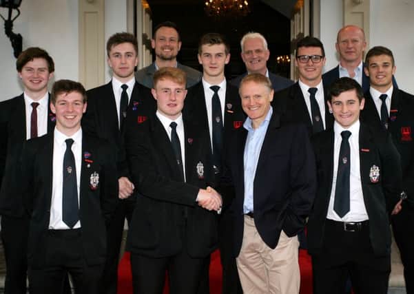 Ireland rugby team head coach Joe Schmidt is welcomed to the Ballymena Academy rugby dinner by the schools 1st XV captain Josh McIlroy. Included are senior team members, principal Stephen Black, Gavin Murray and Alaister McKay. INBT21-236AC
