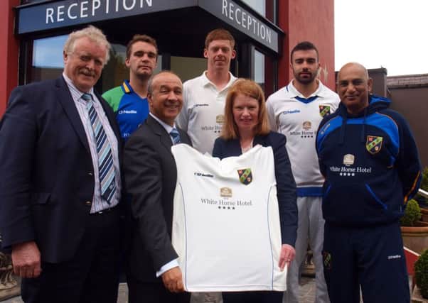 Issam Horshi and Ramona Wylie of White Horse INN sponsoring the new North West Warriors playing kits. Also pictured from left to right are John McMillan (President North West Cricket Union), Andy McBrine, Craig Young, Stuart Thompson and Bobby Rao (NW Warriors Coach).