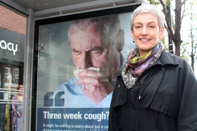 Dr Miriam McCarthy, Consultant at the Public Health Agency (PHA), at one of the PHA's 'coughing' bus shelters.
